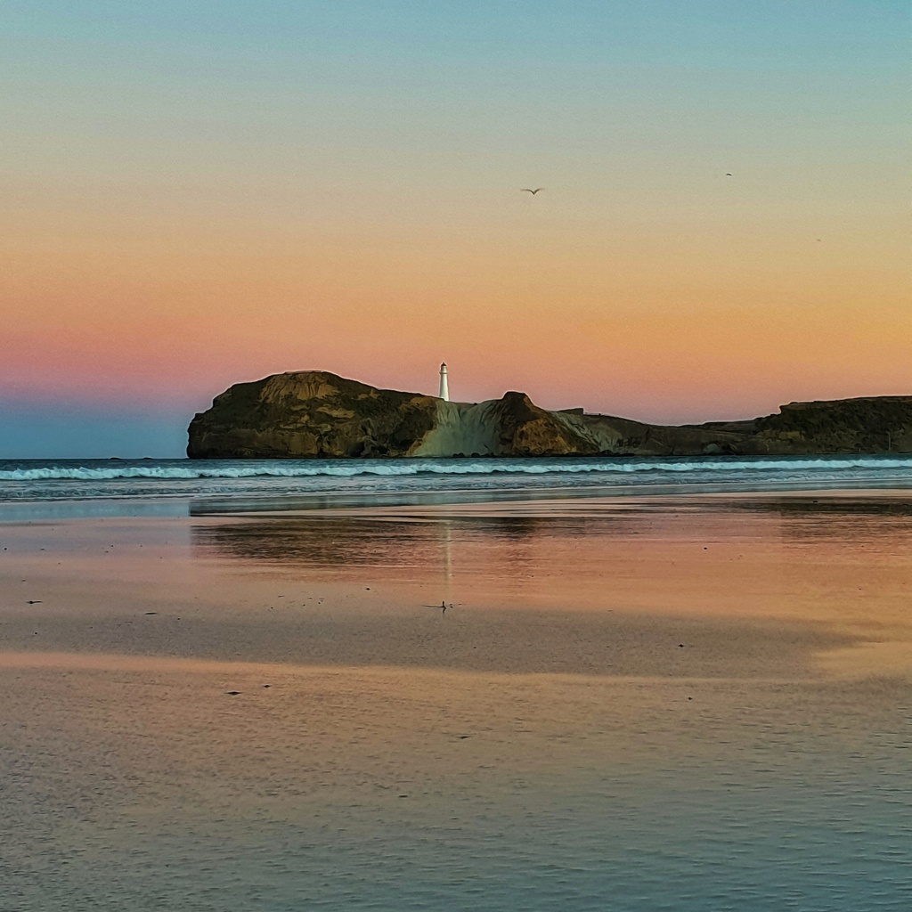 Castlepoint Lighthouse New Zealand at Sunset
