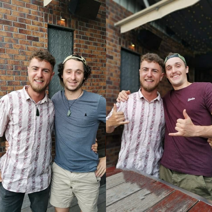 couple of guys pose for a photo